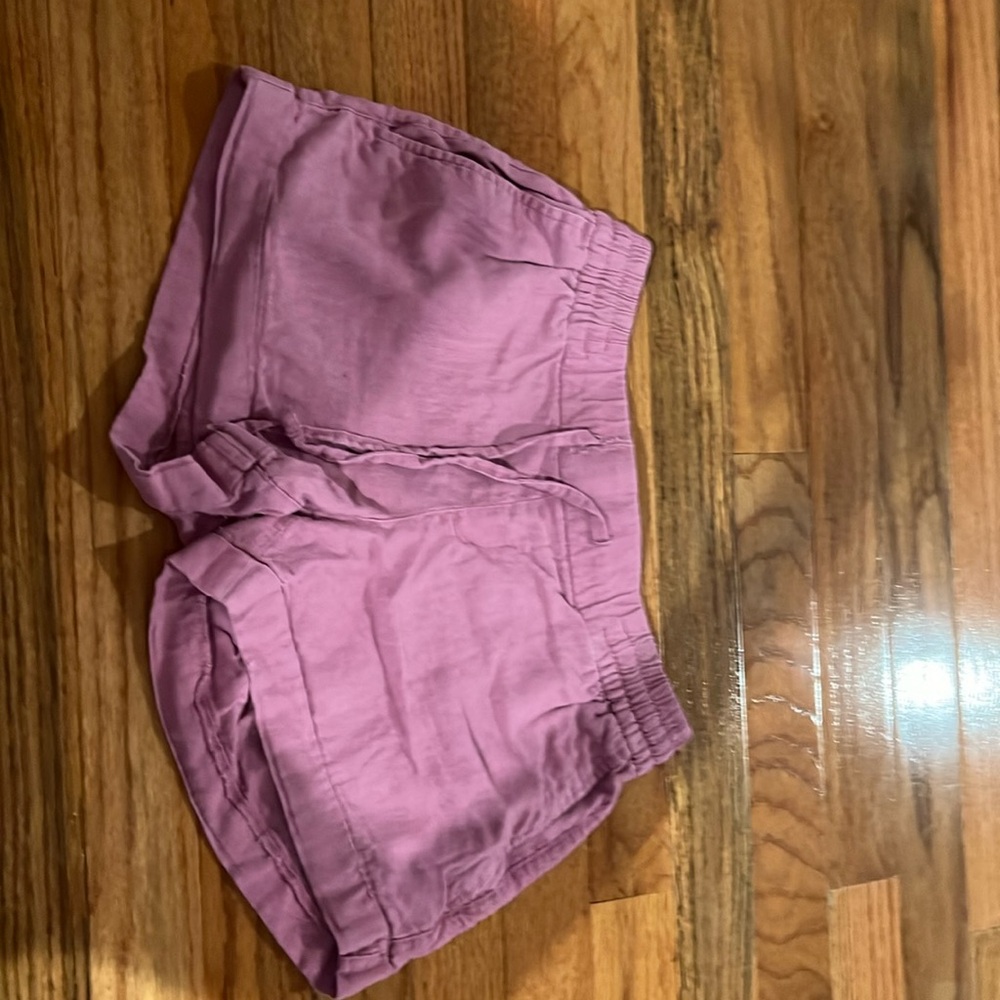 Pink shorts with 2 pockets in the front the pockets in back are just for show
